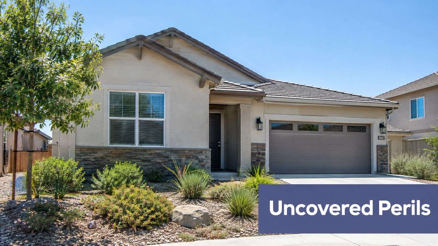 A modern single-story residential suburban home with desert landscaping under a clear blue summer sky.